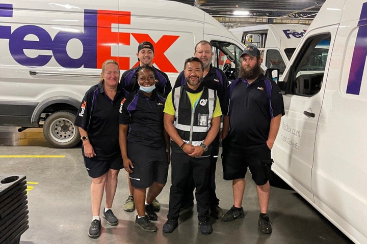 Jeb Lopez (center) congregates with his team at Wheelz Up, a last-mile delivery service that has contracts with FedEx and Amazon. Lopez just bought four new Nissan NV 2500 cargo vans. He says there were six other buyers waiting for those units and they were willing to pay an additional $1,000 to $2,000 more.  - Photo: Jeb Lopez, Wheelz Up