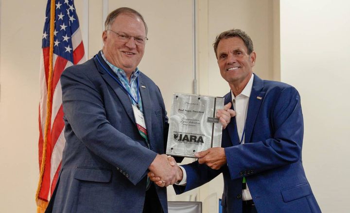 Tony Long recognized Paul Seger's two-year term as IARA President, which ended Aug. 26. - Photo: IARA