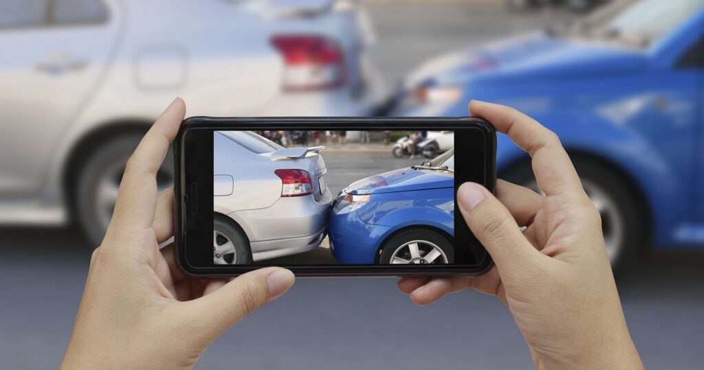 Taking photos of car crash damage for insurance with a smartphone