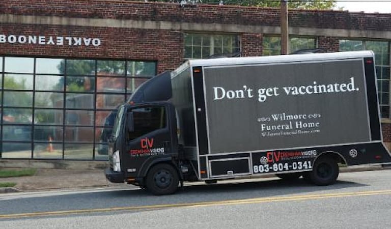 Truck delivers 'funeral home' reverse psychology to the unvaccinated